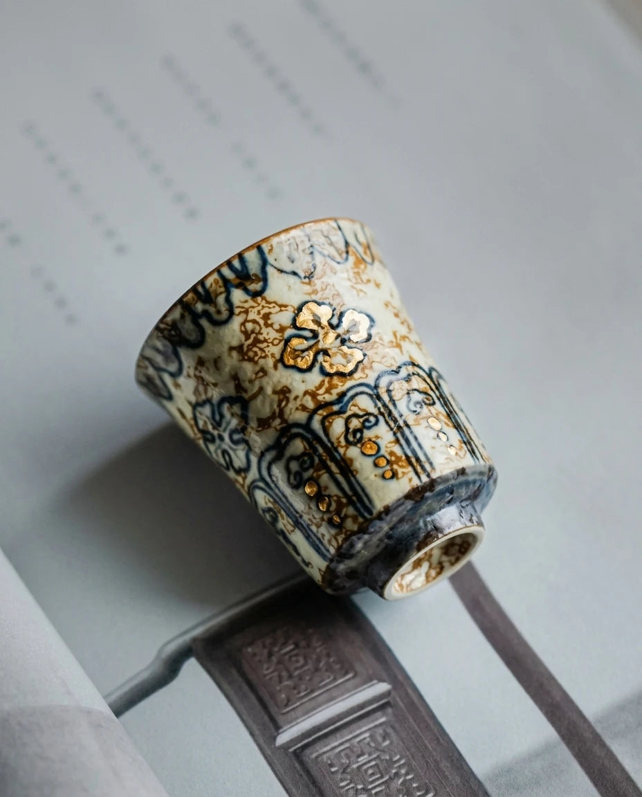 Gold-Rimmed Blue & White Master Cup: Artistic composition on ritual table