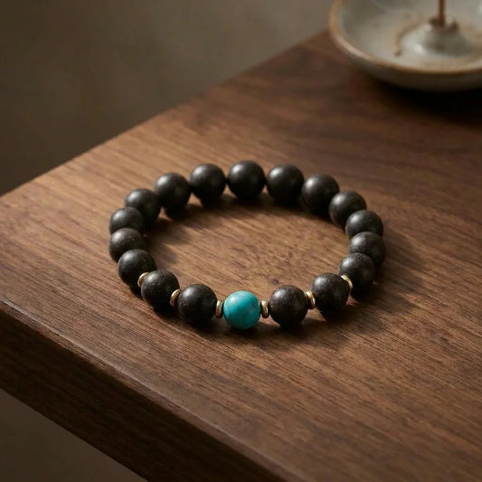 Violet Ease He-Xiang bead bracelet on premium walnut tabletop