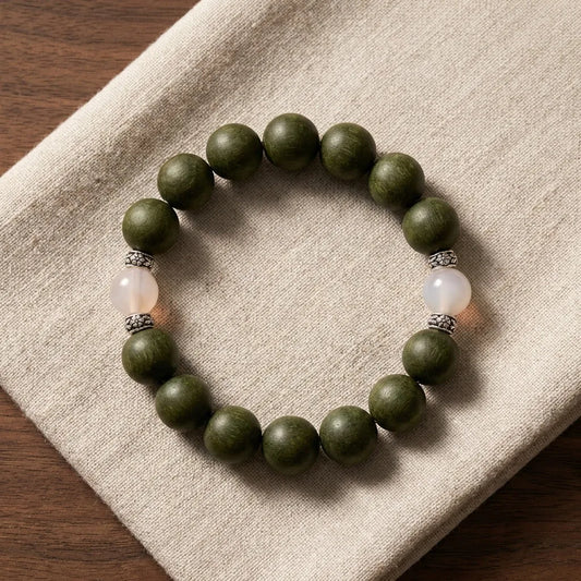 Day Reset bracelet - top view, deep moss green botanical incense beads with white agate