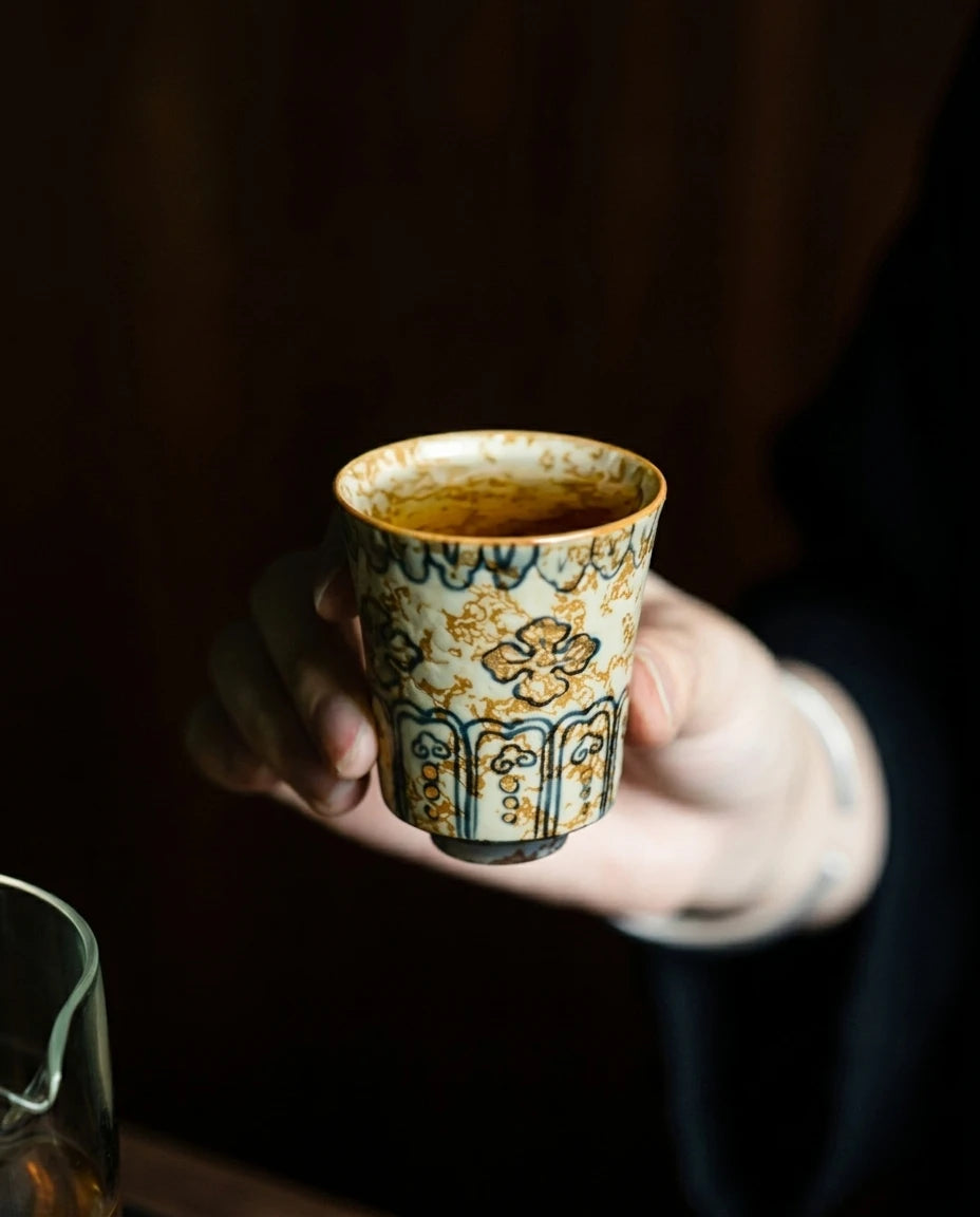 Gold-Rimmed Blue & White Master Cup: Hand-held shot showing fine detailing