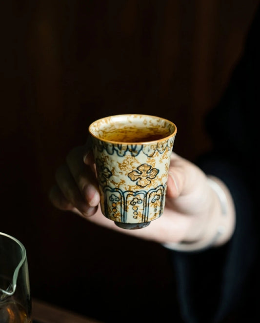 Gold-Rimmed Blue & White Master Cup: Hand-held shot showing fine detailing